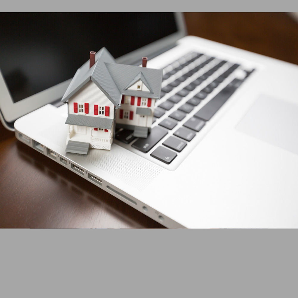 image of a model home & keyboard, representative of the Mortgage Renewal service provided by Canadian Mortgage Broker Michelle Campbell