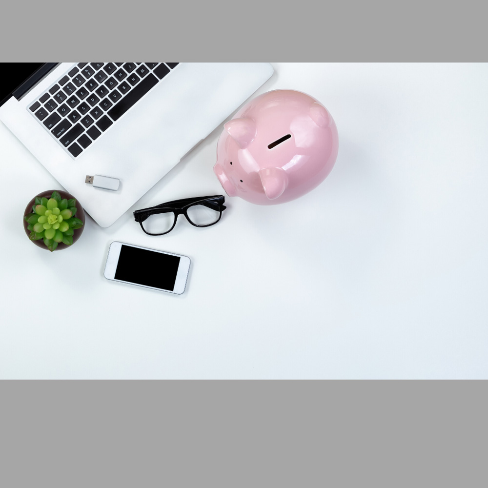 image of a piggy bank, glasses & laptop, representative of the Mortgage refinance, equity-takeout service provided by Canadian Mortgage Broker Michelle Campbell