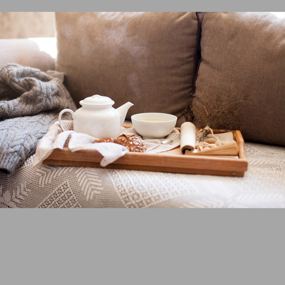 image of a tea tray setting on a couch, representative of the revers mortgage service provided by Canadian Mortgage Broker Michelle Campbell